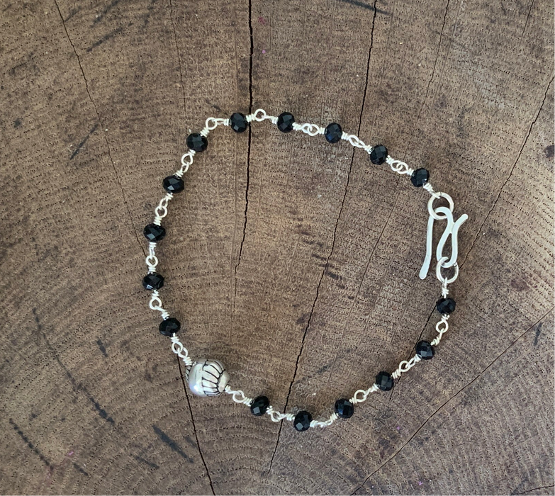 Sterling silver bracelet with silver bead and black Swarovski crystal beads