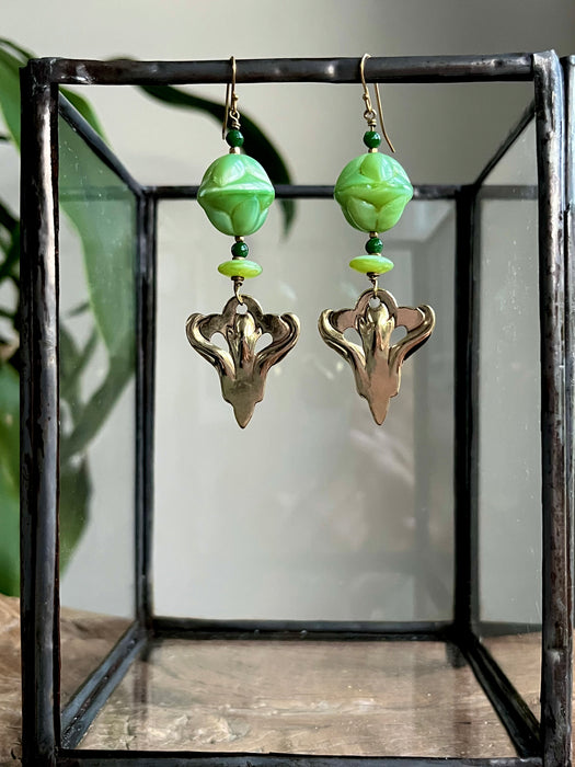 Earrings with Czech Art Deco glass beads and up-cycled brass pendant.