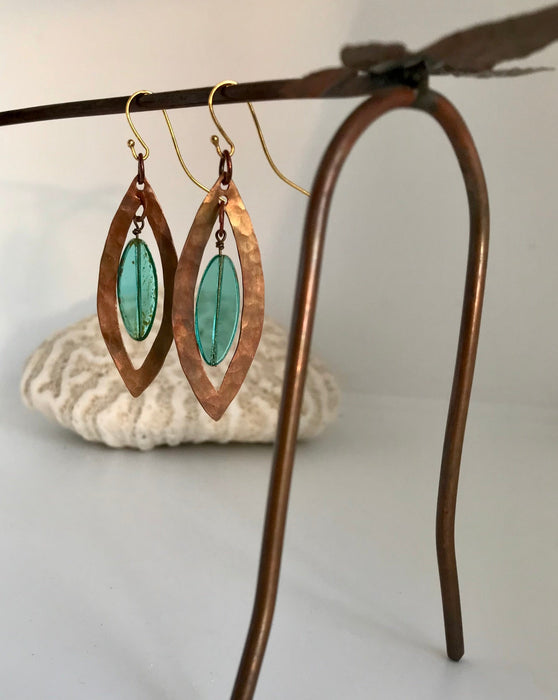 Eye-shaped copper earrings with turquoise glass beads